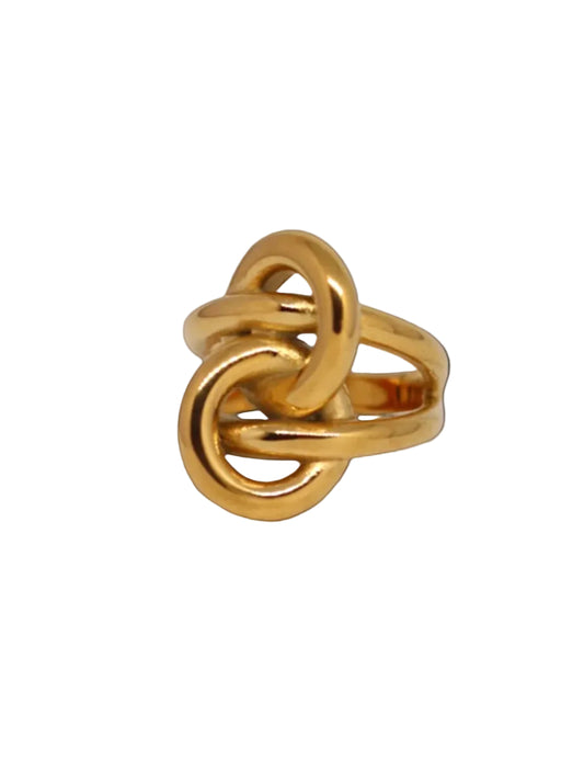 Gold knot ring on a light gray background