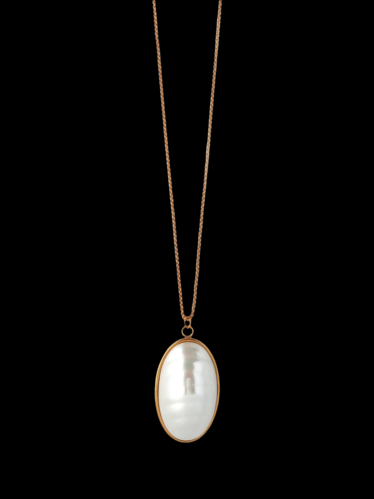 Necklace with a large, oval-shaped pearl pendant on a light gray background