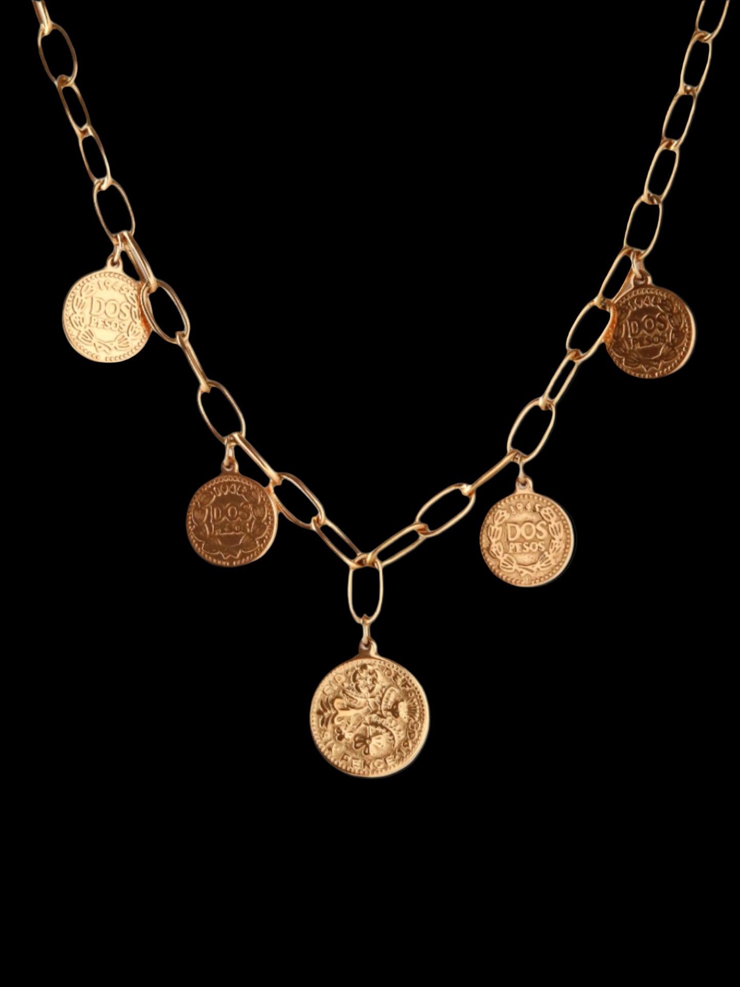 Gold chain necklace with coin pendants on a white background