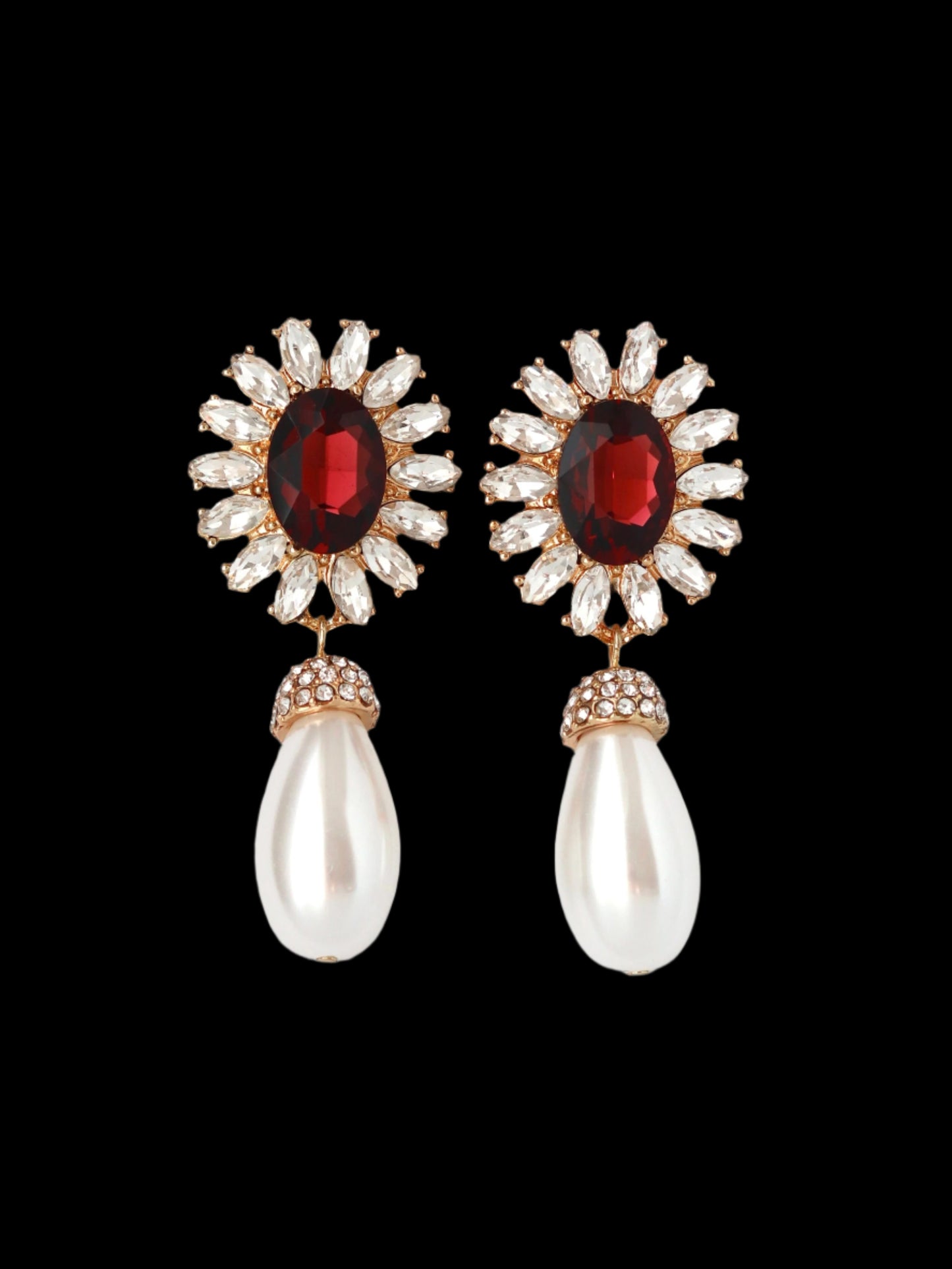 Pair of earrings with gemstones and pearls on a white background