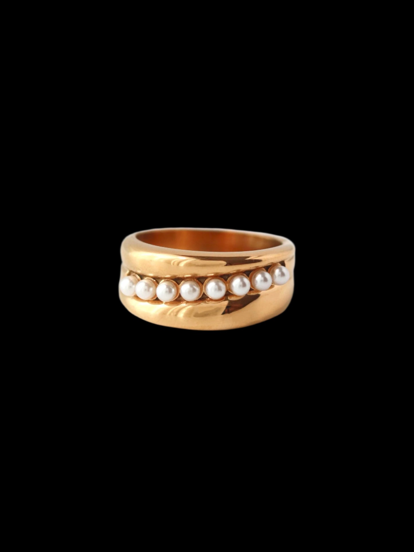 Gold ring with pearls on a white background