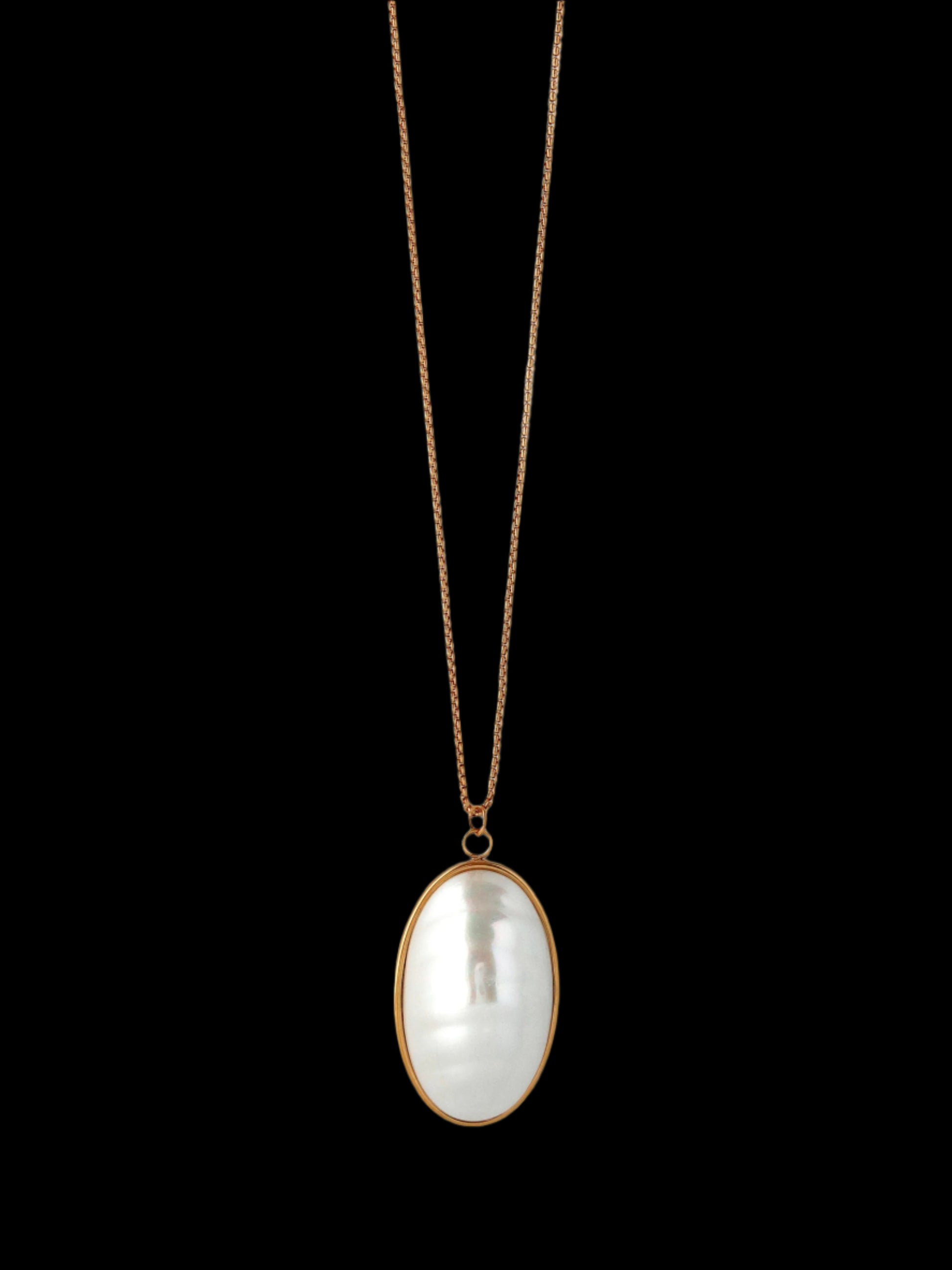 Necklace with a large, oval-shaped pearl pendant on a light gray background