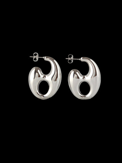 Pair of silver hoop earrings on a white background