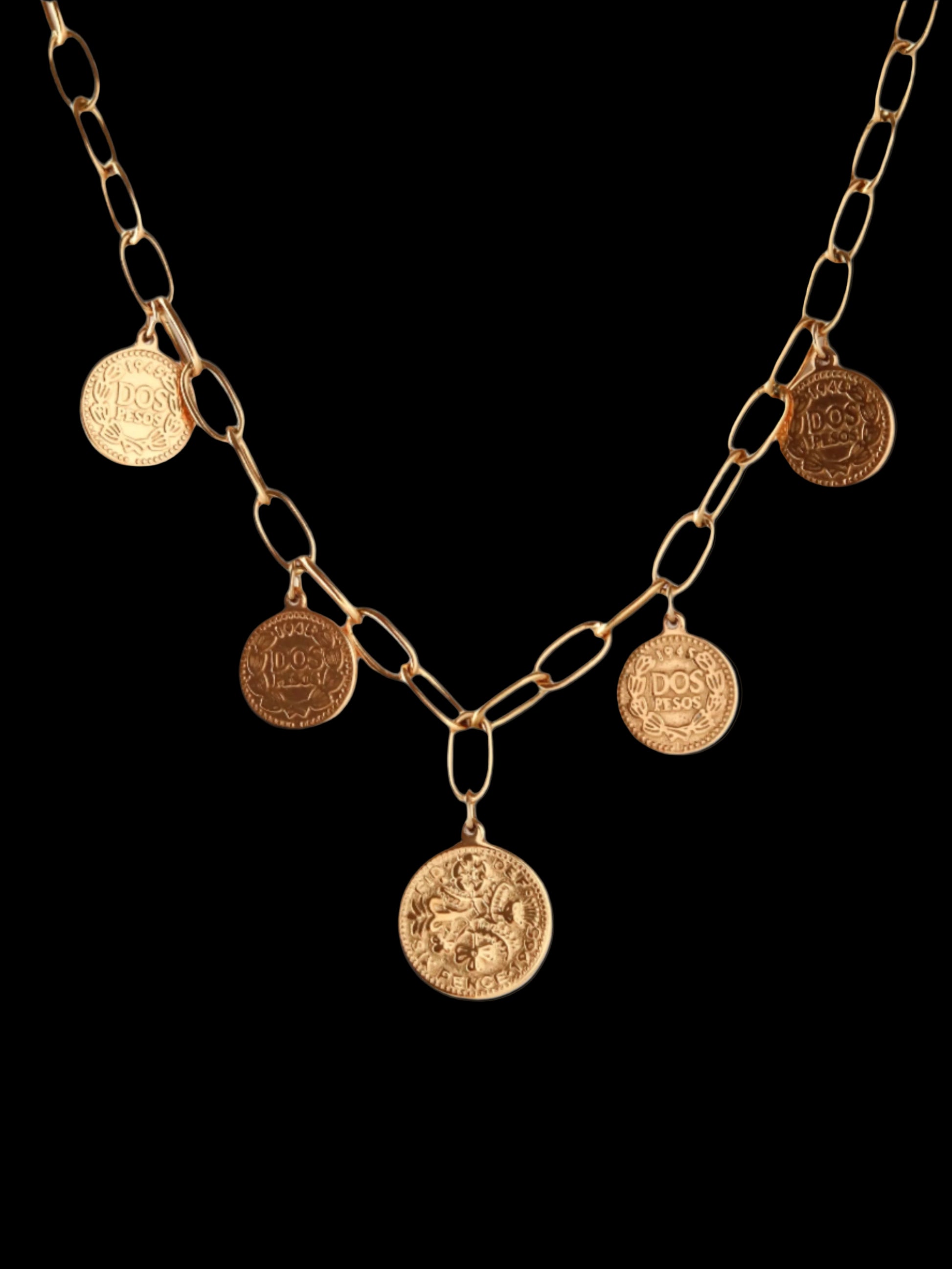 Gold chain necklace with coin pendants on a white background