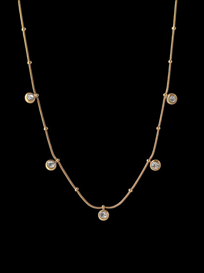 Gold necklace with small gemstones 