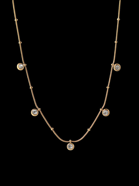 Gold necklace with small gemstones 