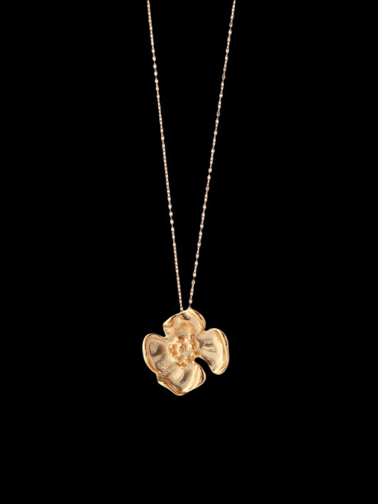 Gold necklace with a floral pendant 