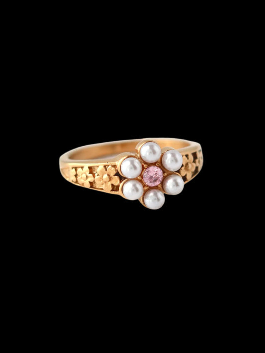 Gold ring with pearls and a pink gemstone 