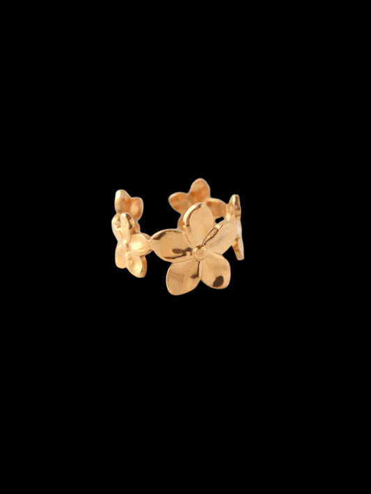 Gold butterfly-shaped earring on a white background
