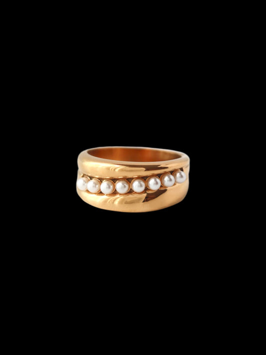 Gold ring with pearls on a white background