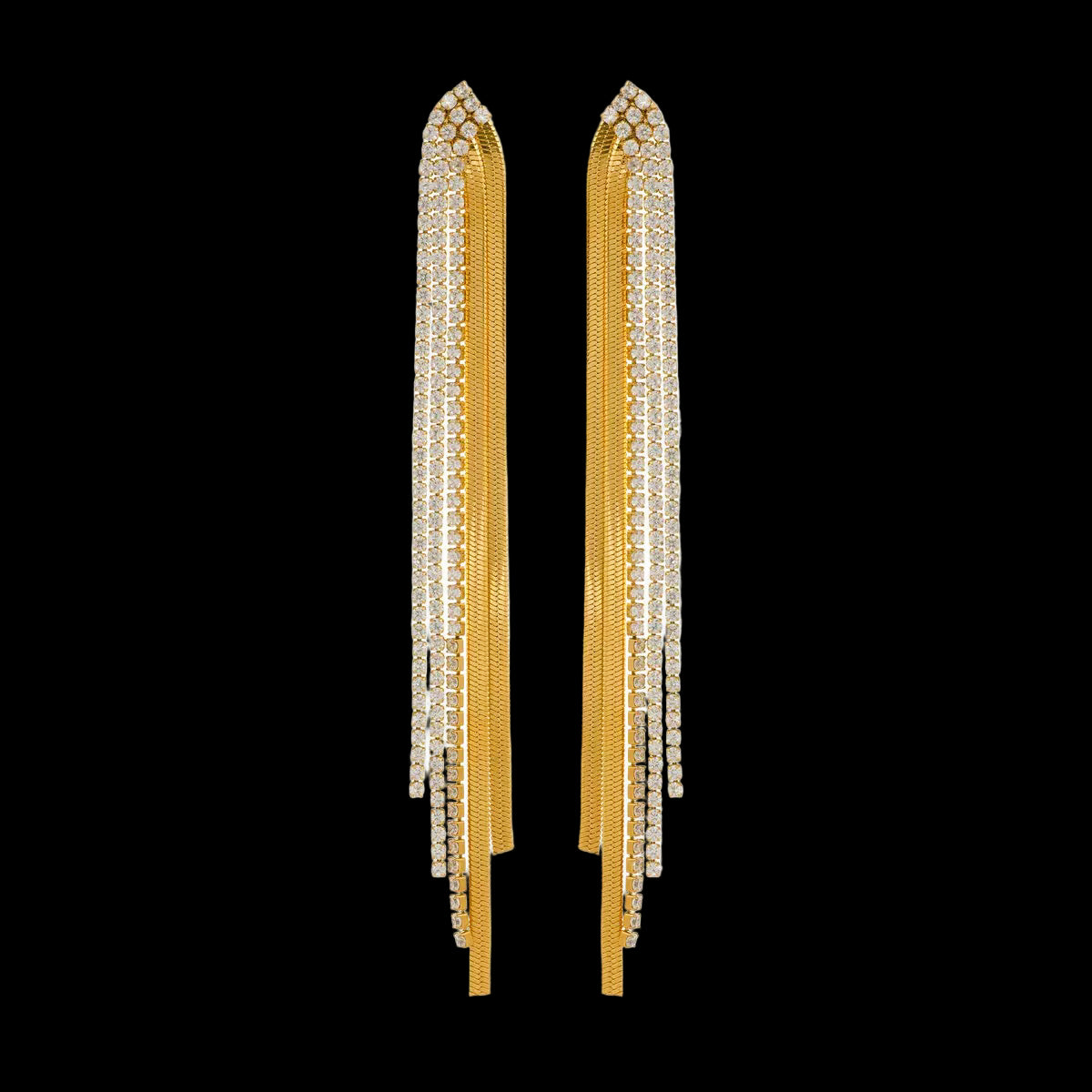 Gold tassel earrings on a white background