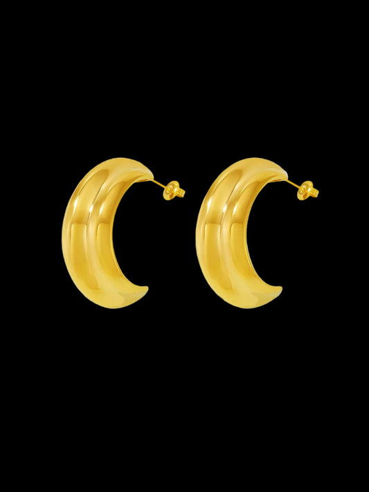 Pair of gold hoop earrings on a white background